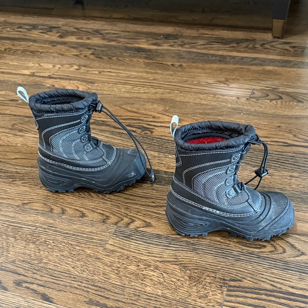 The North Face Kids Black Snow Boots with Red Lining